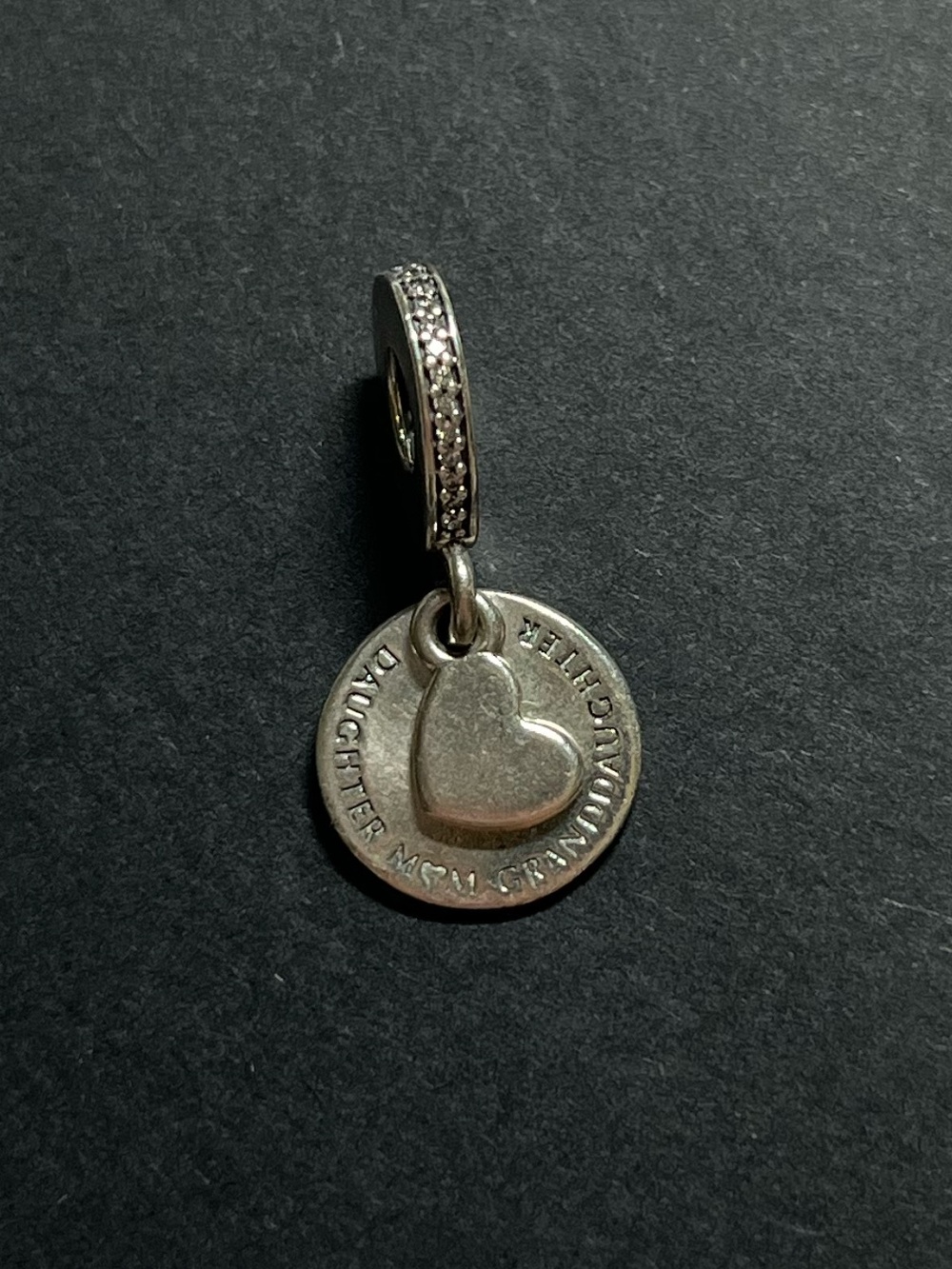 Pandora sterling silver charm
925
“Daughter, mom, grandmother”